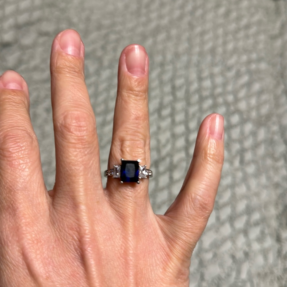 Sterling silver blue sapphire and cubic zirconia diamonds.